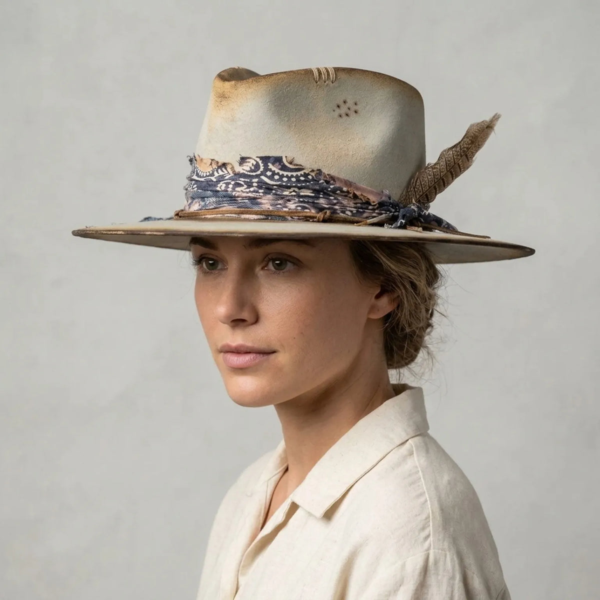 Beige Distressed Western Hat with Paisley Band and Feather