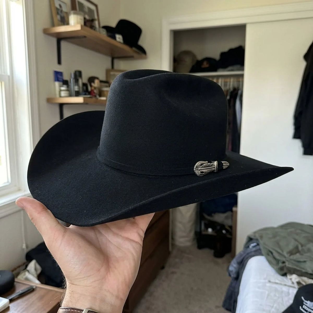 Black Felt Cowboy Hat with Tall Pinched Crown and Upturned Brim