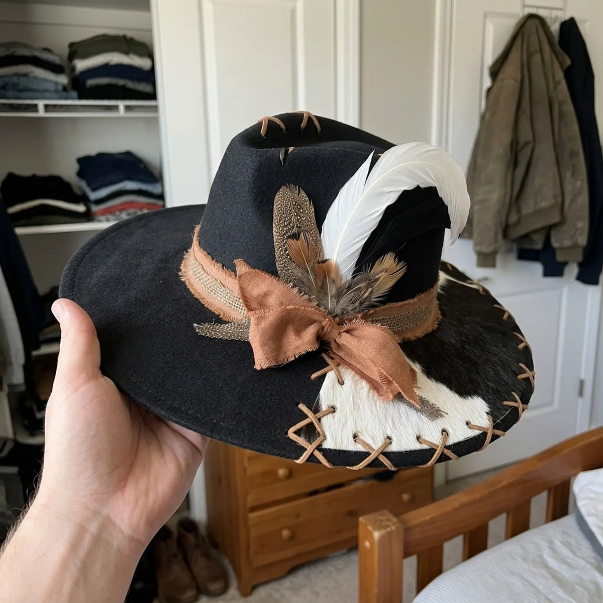 Black Western Hat with Cowhide Brim Cross Lacing White Feather