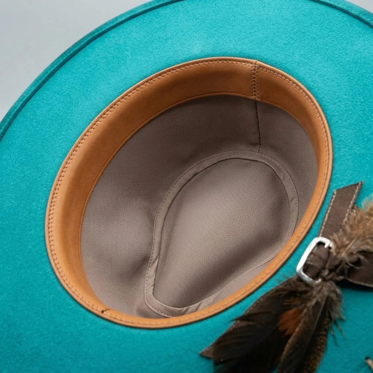Teal Satin Cowboy Hat with Cow Print Brim and Feather Cluster