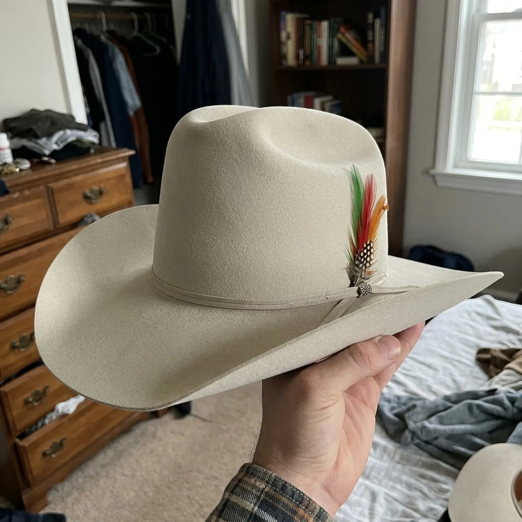 Cream Wool Felt Cowboy Hat with Feather Accent and Upturned Brim